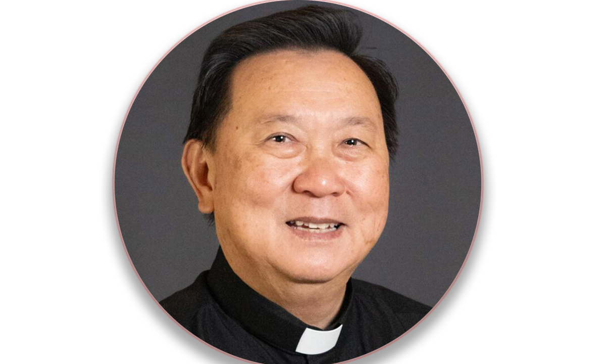 Catholic priest praying